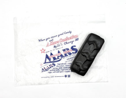 Black candy bar with Mars branding on a white background