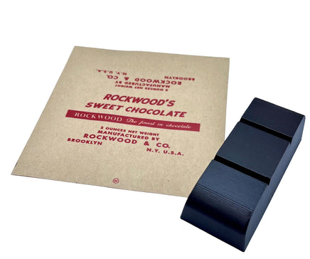  chocolate bar with a vintage-style promotional card for Rockwood's Sweet Chocolate on a white background.