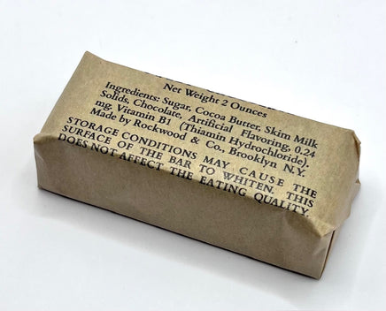 Kraft paper-wrapped chocolate bar with text on a white background