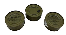 Three k ration food cans on a white background