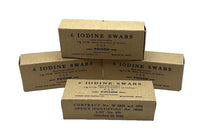 Four vintage brown cardboard boxes for '6 Iodine Swabs' stacked on a white surface against a light gray background. The boxes feature black printed text including 'POISON' and manufacturer details for Handmade Drug Supply Co.